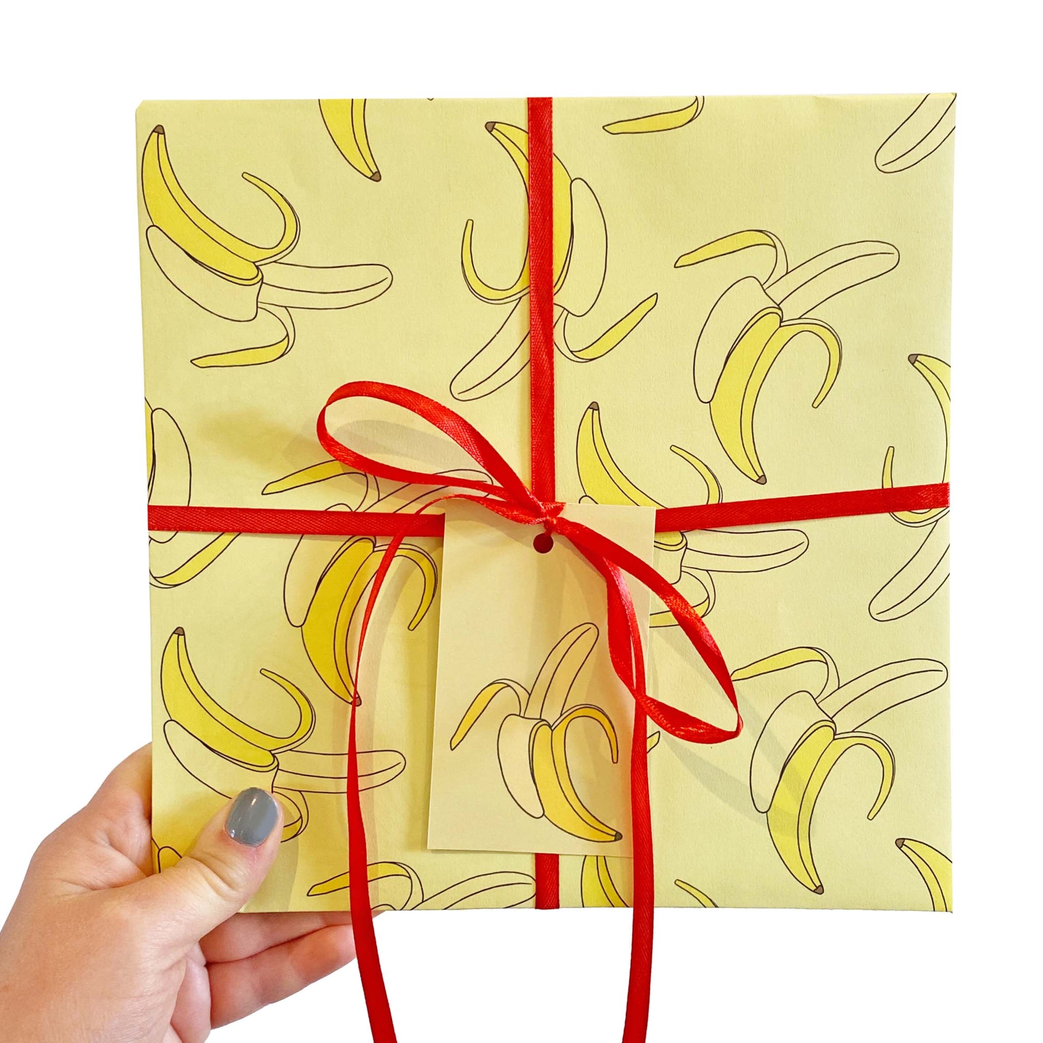 Yellow wrapping paper covered in a banana pattern