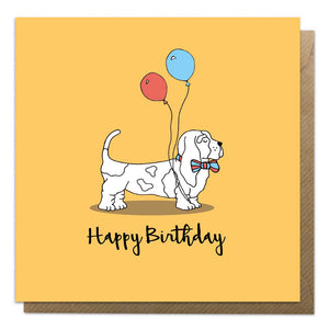 Orange card with an illustration of a bassett hound