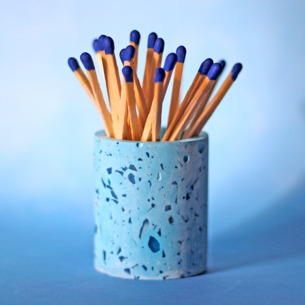 Blue match pot with blue matches