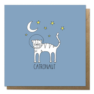 Blue greeting card with an illustration of a cat astronaut