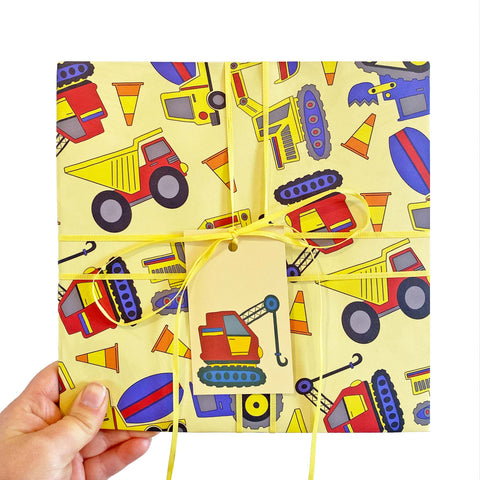 Yellow wrapping paper with a digger pattern