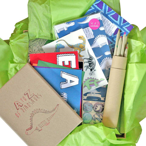 Dinosaur gift box featuring a colouring book, badges and transfer tattoos