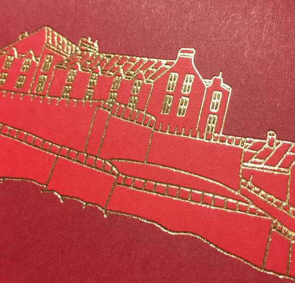 Close up detail of gold foiled Edinburgh castle