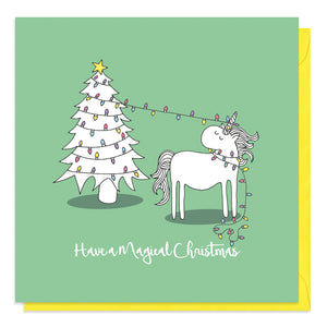 Green Christmas card with an illustration of a unicorn in fairy lights