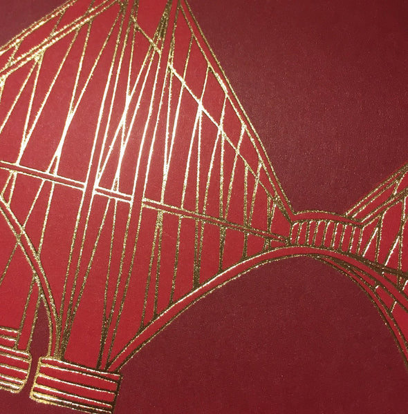 Close up detail of gold foiled Forth Rail Bridge