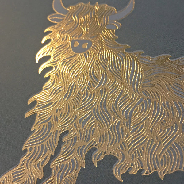 Close up detail of gold foiled highland cow