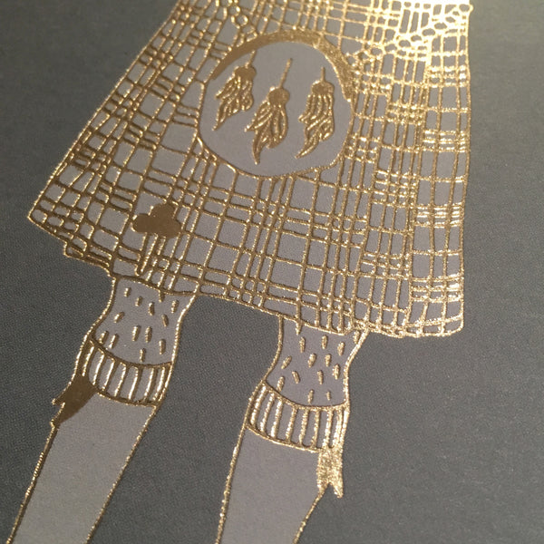 Close up detail of gold foil kilt card