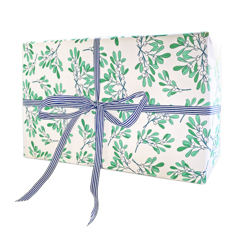Mistletoe patterned wrapping paper with a bow