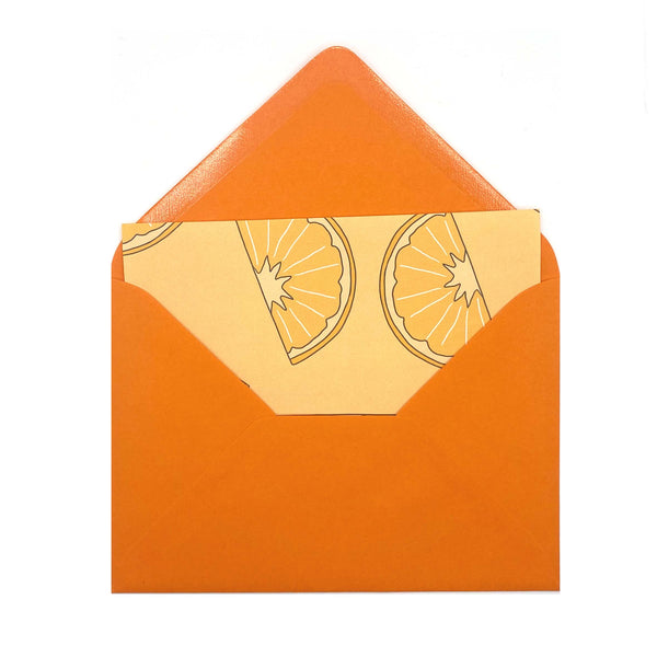 Orange letter paper in an orange envelope