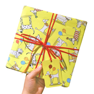 Bright yellow wrapping paper with illustrations of dogs