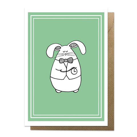 Green greeting card with an illustration of a white rabbit