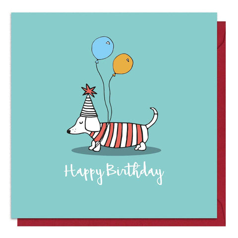 Green birthday card with an illustration of a sausage dog