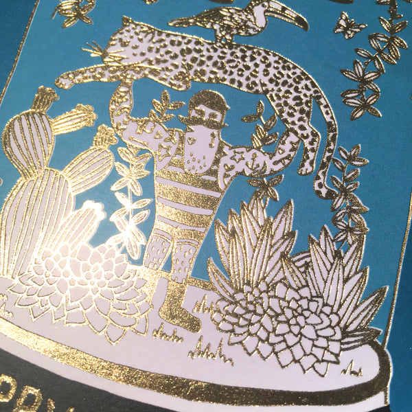 Close up gold detail on strongman bell jar card