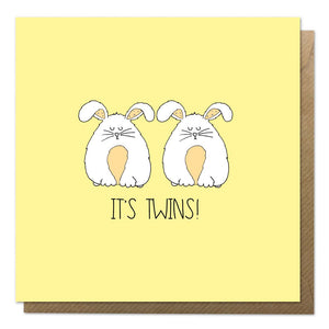 Yellow new twins card featuring two fluffy rabbits