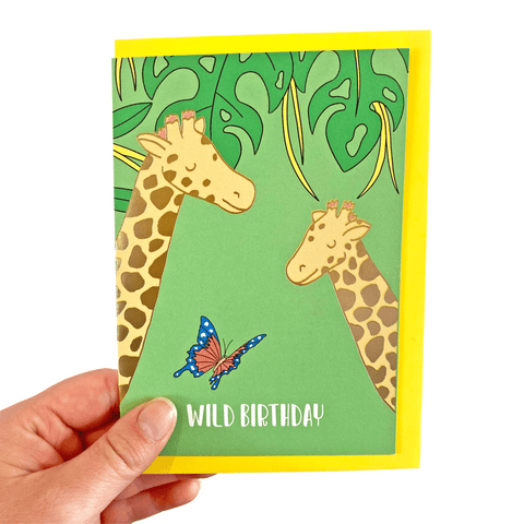 Green birthday card with two gold foil giraffes