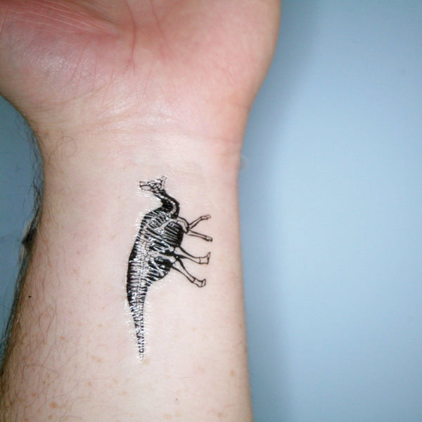 Example of dinosaur transfer tattoo on wrist